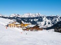 Downhill slope and apres ski mountain hut with restaurant terrace in Saalbach Hinterglemm Leogang winter resort, Tirol