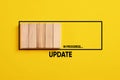 Downloading and installing updates or upgrading technology concept. Update loading in progress bar on yellow background Royalty Free Stock Photo