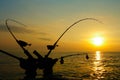 Downrigger Fishing Rods for Salmon at Sunrise Royalty Free Stock Photo
