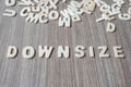 DOWNSIZE word of wooden alphabet letters. Business and Idea