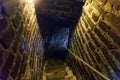 Downstairs in ancient stone tower tunnel Royalty Free Stock Photo