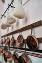 Curing Meat and Brass Pans in an English Manor House Kitchen Royalty Free Stock Photo