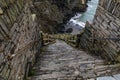 Downstairs are steep stone steps