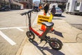 Downtown Atlanta city scene with electric scooter and people