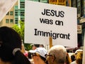 Protest against ICE and Customs and Border Patrol Detention Centers. Woman carries sign that reads `Jesus was an Immigrant`