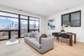 A downtown Chicago living and dining room with a skyline view.