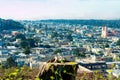 Downtown cityscape with church and office and business buildings in city with bright sunny rooftops and streets Royalty Free Stock Photo