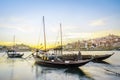 Downtown cityscape by Douro river with old boats, Porto, Portugal