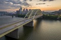 Downtown district of Cincinnati city in Ohio, USA at night with driving cars traffic on Daniel Carter Beard Bridge and Royalty Free Stock Photo