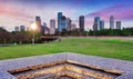 Downtown Houston from Police Memorial park at dramatic sunset. Green park lawn and modern skylines. The most populous city in