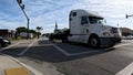 Downtown Lakeland Florida passing semi truck at a 4 way intersection Royalty Free Stock Photo