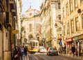 Downtown Lisboa, Portugal, a Yellow tram and Loreto church