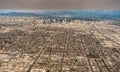 Downtown los angeles skyline and suburbs from airplane and smoke from wild fires