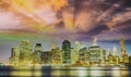 Downtown Manhattan at night from Brooklyn Bridge Park. New York City skyscrapers reflections in the river Royalty Free Stock Photo