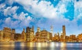 Downtown Manhattan at night from Brooklyn Bridge Park. New York City skyscrapers reflections in the river Royalty Free Stock Photo