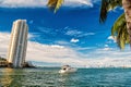 Downtown Miami along Biscayne Bay with condos and office buildings, yacht sailing in the bay Royalty Free Stock Photo