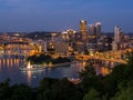 Downtown Pittsburgh skyline at night with rivers, bridges, and the fountain at Point State Park Royalty Free Stock Photo