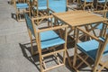 Downtown restaurant terrace with folding canvas chairs