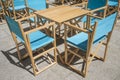 Downtown restaurant terrace with folding canvas chairs