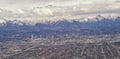 Downtown Salt Lake City Panoramic view of Wasatch Front Rocky Mountains from airplane in early spring winter with melting snow and Royalty Free Stock Photo