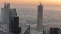 Downtown skyline with modern architecture form above timelapse. Aerial view of Dubai business bay towers. Royalty Free Stock Photo