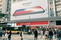 Downtown street atmosphere with attractive Apple iPhone X billboard on building in Hong Kong