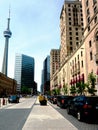 Toronto Front street. famous TV tower and vintage stone hotel buildings