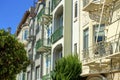 Downtown urban apartment building comple with decorative front facades and white exteriors with windows and balconies Royalty Free Stock Photo