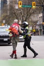 DOWNTOWN VANCOUVER, BC, CANADA - APR 26, 2020: Anti lockdown protesters march in defiance of the government imposed Royalty Free Stock Photo