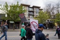 DOWNTOWN VANCOUVER, BC, CANADA - APR 26, 2020: An antifa member disrupts an anti lockdown protest march.