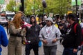 DOWNTOWN VANCOUVER, BC, CANADA - APR 26, 2020: An antifa member disrupts an anti lockdown protest march.