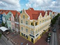 Downtown Willemsted historic city street colourful buildings with pastel-colored colonial architecture