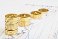 Downtrend coins stacks on financial chart. Royalty Free Stock Photo