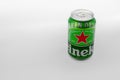a downview shot of a green can of heineken beer on a white surface with space for text Royalty Free Stock Photo