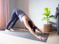 Downward facing dog yoga pose asian woman home workout fitness body weight exercise pilates health training sport healthy Royalty Free Stock Photo