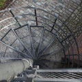 Downward Spiral, Spiral staircase in old town in Warsaw, Poland Royalty Free Stock Photo