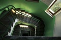 Downward spiral vintage staircase in old building. Royalty Free Stock Photo