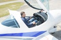 Downward view man in cockpit aircraft