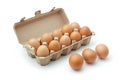 Open carton of brown eggs on white background. Neural network AI generated Royalty Free Stock Photo