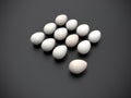 Dozen of eggs on dark grey background