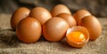 A dozen eggs with one cracked open Royalty Free Stock Photo