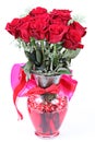 Dozen red roses in vase