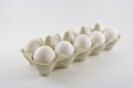 Dozen white chicken eggs in a box