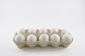 Dozen white eggs in a box isolated