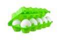 Dozen white eggs in bright green plastic package on white background isolated closeup side view Royalty Free Stock Photo