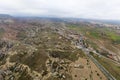 Dozens of balloons fly over the valleys in Cappadocia Royalty Free Stock Photo