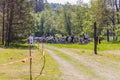 Dozens of bicycles and riders on glade in the forest