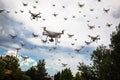 Dozens of Drones Swarm in the Ominous Sky. Royalty Free Stock Photo