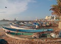 Dozens of fishing boats moored in the sand