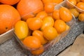 Dozens of oranges piled up in a heap